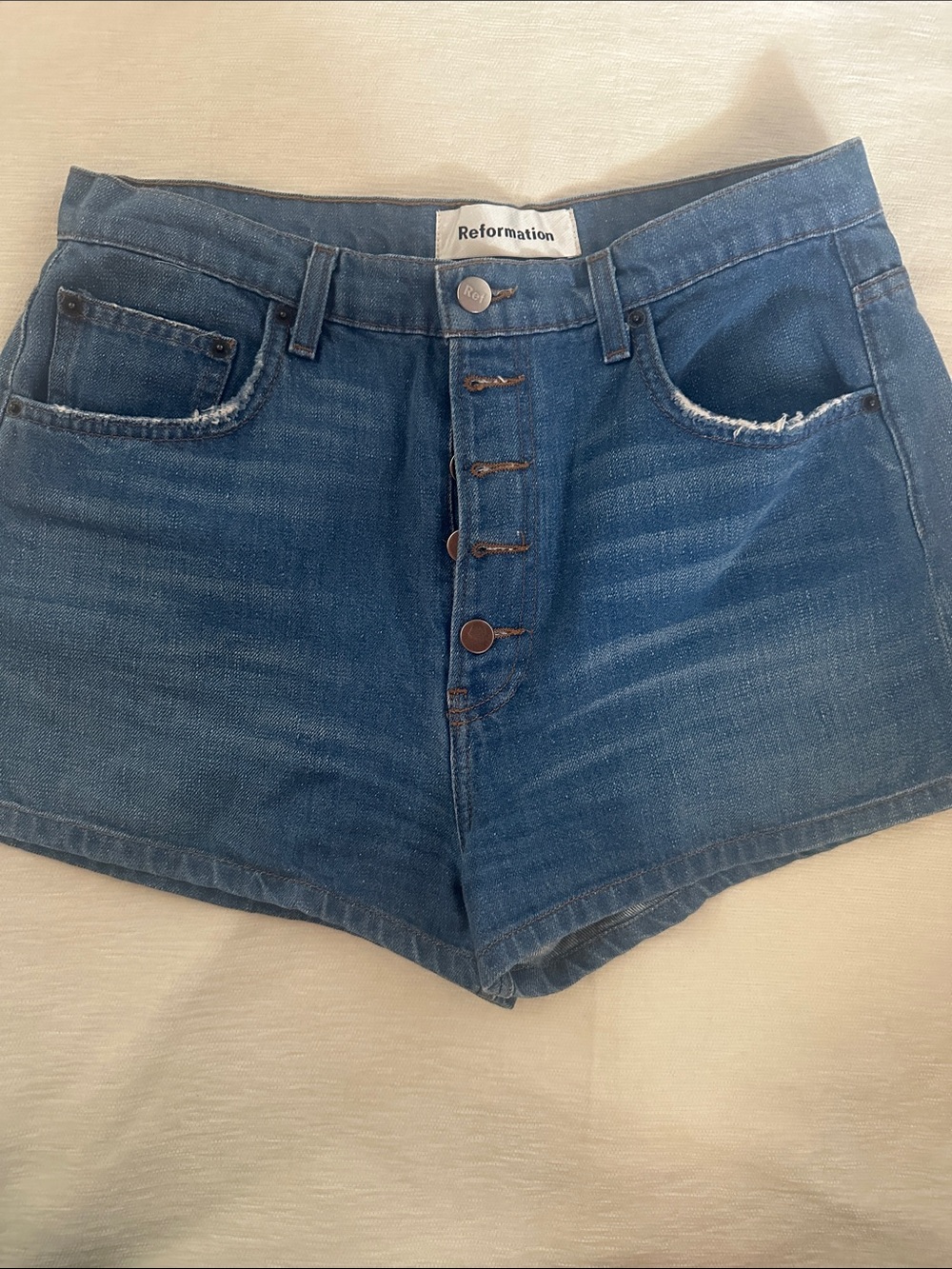 Reformation Button-Front High-Rise Jean Shorts in Blue
